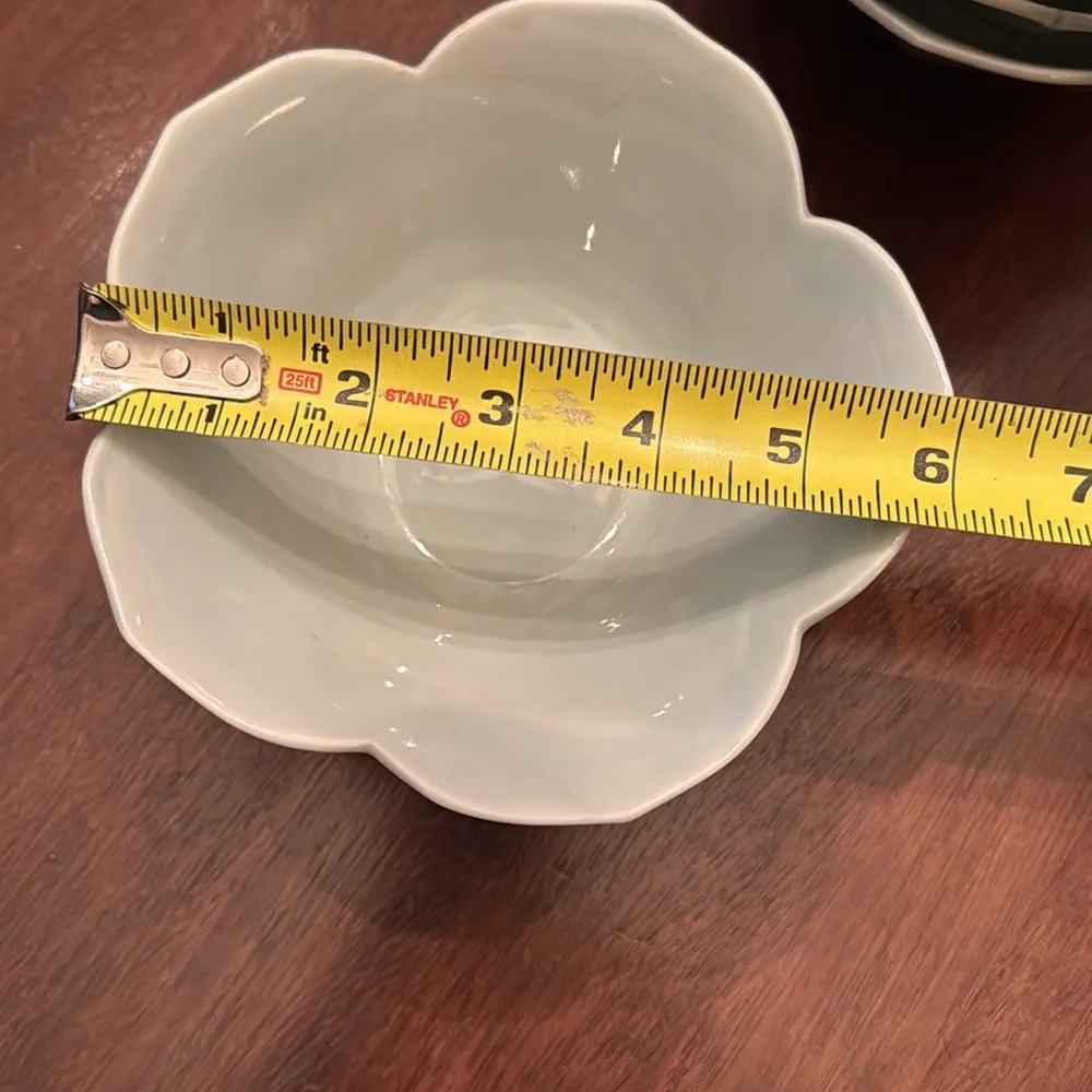 Set of four celadon lotus bowls